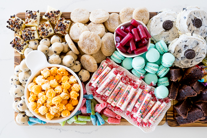 A variety of desserts and candies on the countertop.