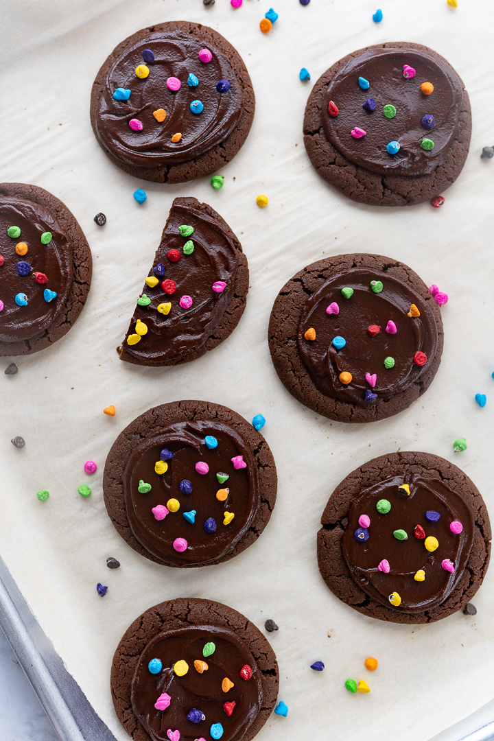 cosmic brownie cookies on the cookie sheet with parchment paper.