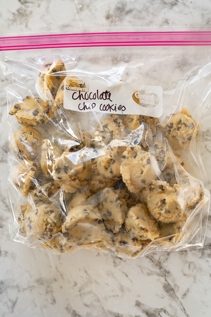 cookie dough in a zip top bag with the bag labeled 'chocolate chip cookies'. 