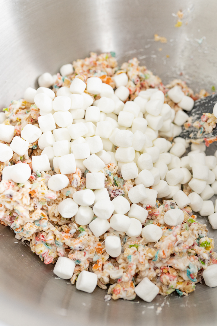 A large bowl of rice krispies and fruity pebbles and marshmallows.