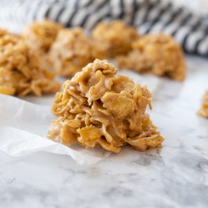 No bake cornflake cookies on parchment on the counter.