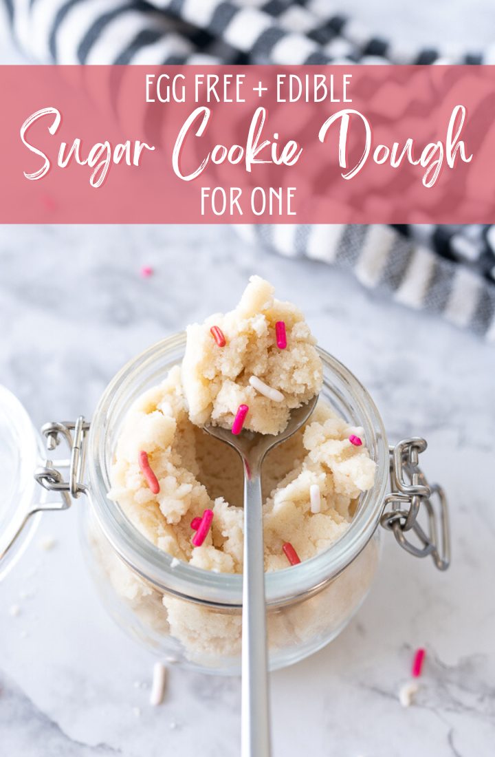 A glass jar filled with cookie dough and pink sprinkles and text on the photo that reads "Egg free + edible sugar cookie dough for one."