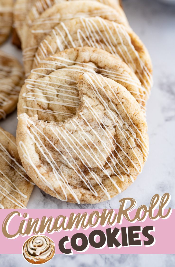Cookies drizzled with white chocolate and text on the photo that reads "cinnamon roll cookies."