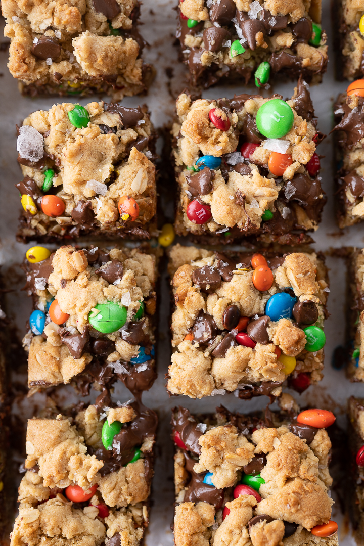 Up close monster cookie bars cut into squares on the counter.