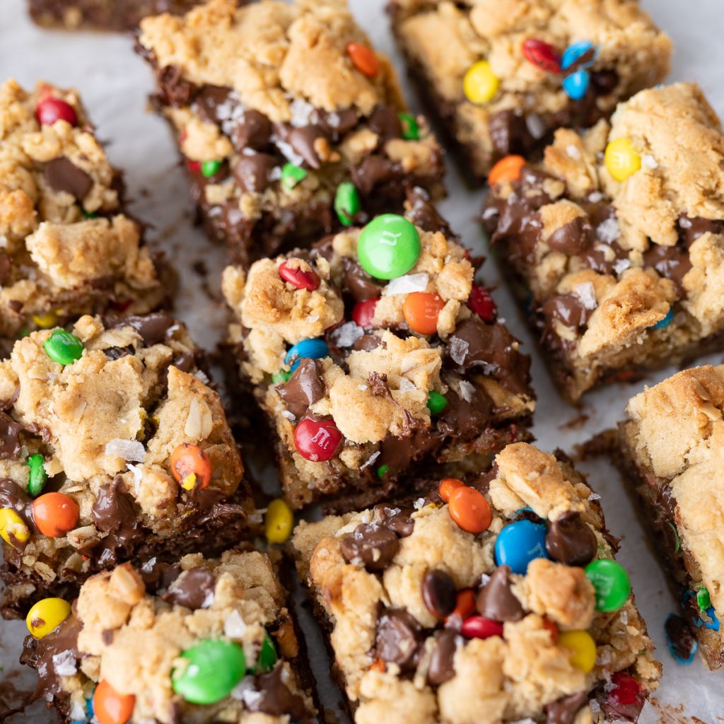 Monster Cookie Bars cut into squares on the counter.