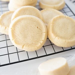 Baked slice and bake sugar cookies on a wire cooling rack.