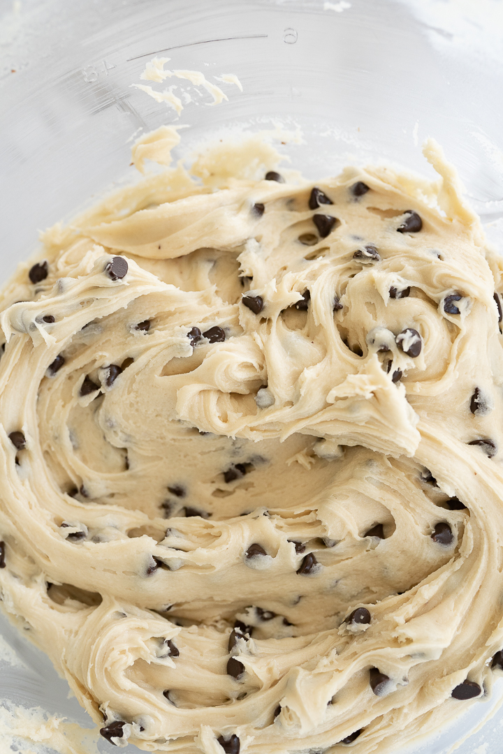 Aerial view of a bowl of cookie dough frosting after being mixed. 