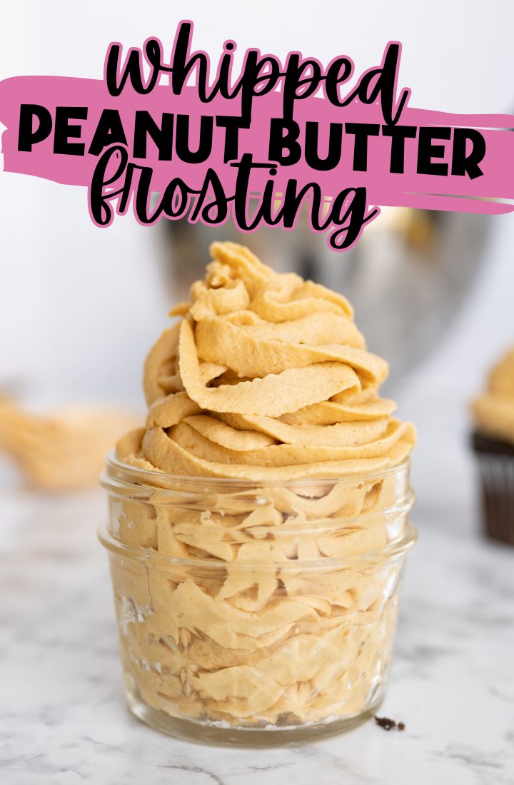 Peanut butter frosting piped into a small glass mason jar. Across the top are the words "whipped peanut butter frosting"
