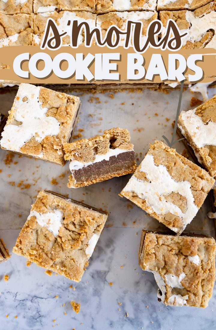 Smores bars cut into squares and arranged on a counter. Across the top it says "smores cookie bars"
