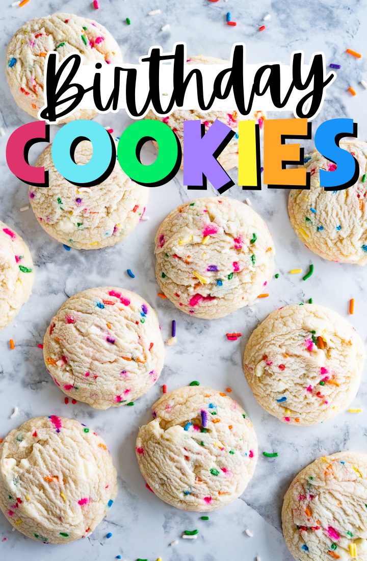 A counter top full of sprinkle birthday cookies. Across the top it says "birthday cookies" in rainbow text.