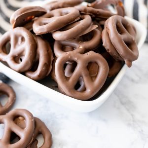 A bowl of chocolate covered pretzels.