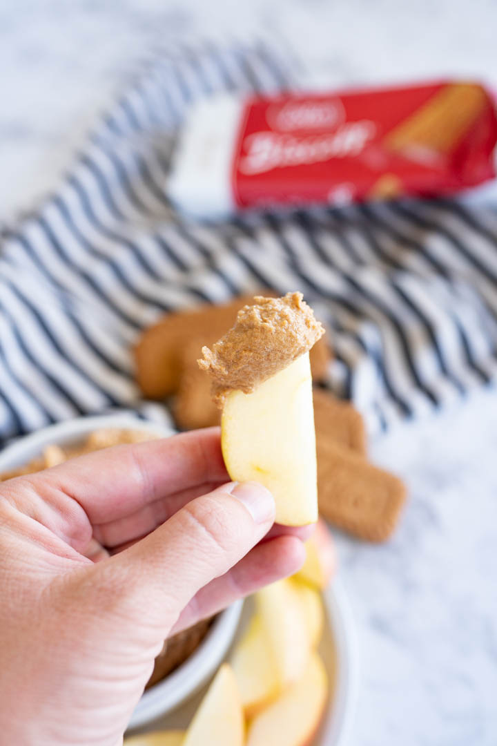 An apple slice dipped in cookie butter. 