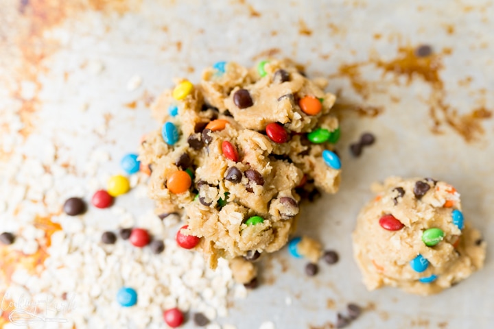 Egg-free cookie dough (monster flavor) heaped on a pan. 