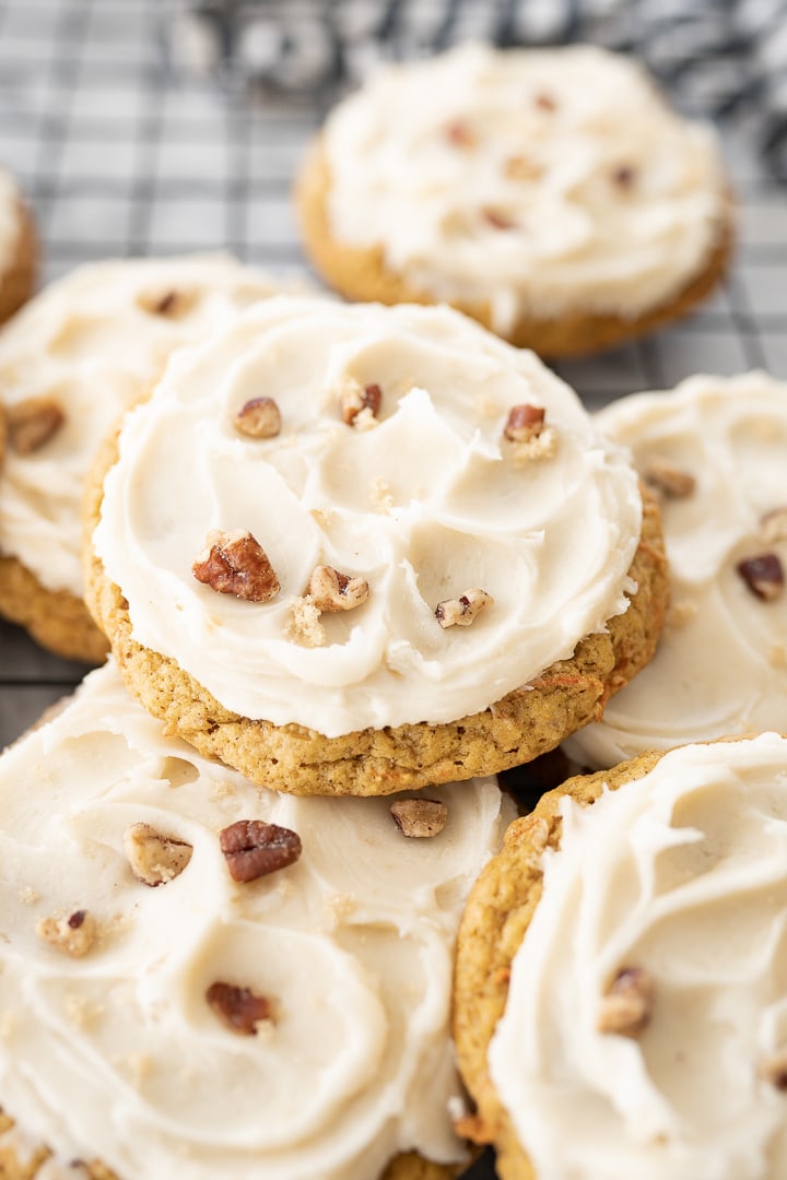 Carrot cake cookies stacked on top of each other. 