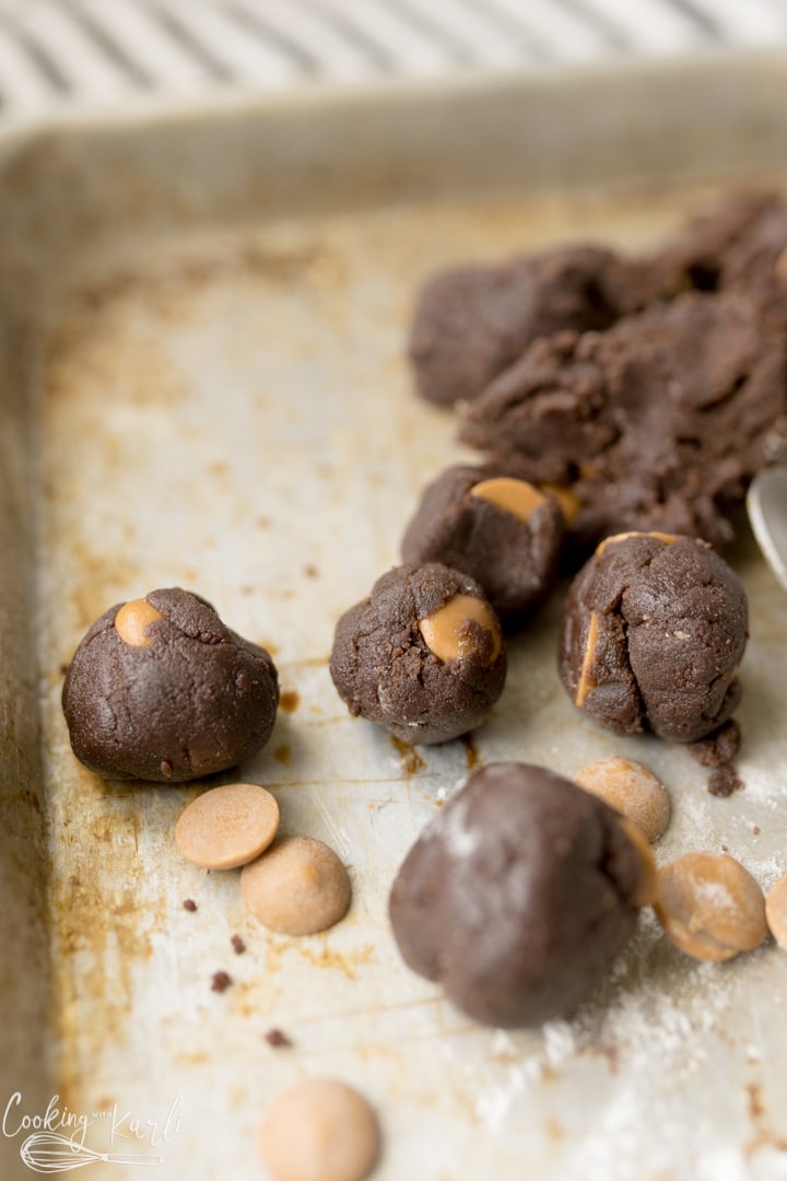 Chocolate edible cookie dough with peanut butter chips in balls. 