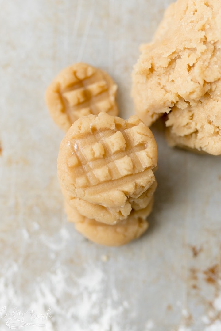 Eggless peanut butter cookie dough flattened with the traditional peanut butter cookie pattern. 