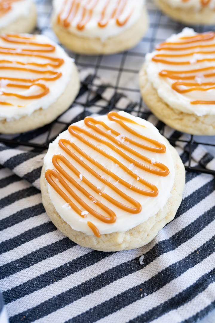 Twisted sugar copycat of salted caramel sugar cookies sitting on top of a striped towel. 