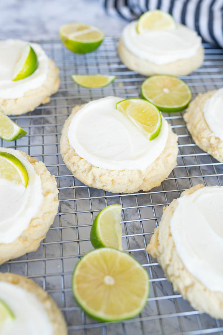 Side view of coconut lime sugar cookie on a wire cooling rack.
