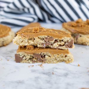 A biscoff oatmeal cookie cut in half and stacked on top of each other.