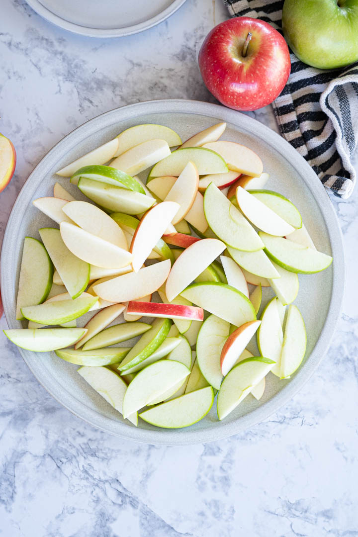 A plate of sliced apples ready to become apple nachos. 