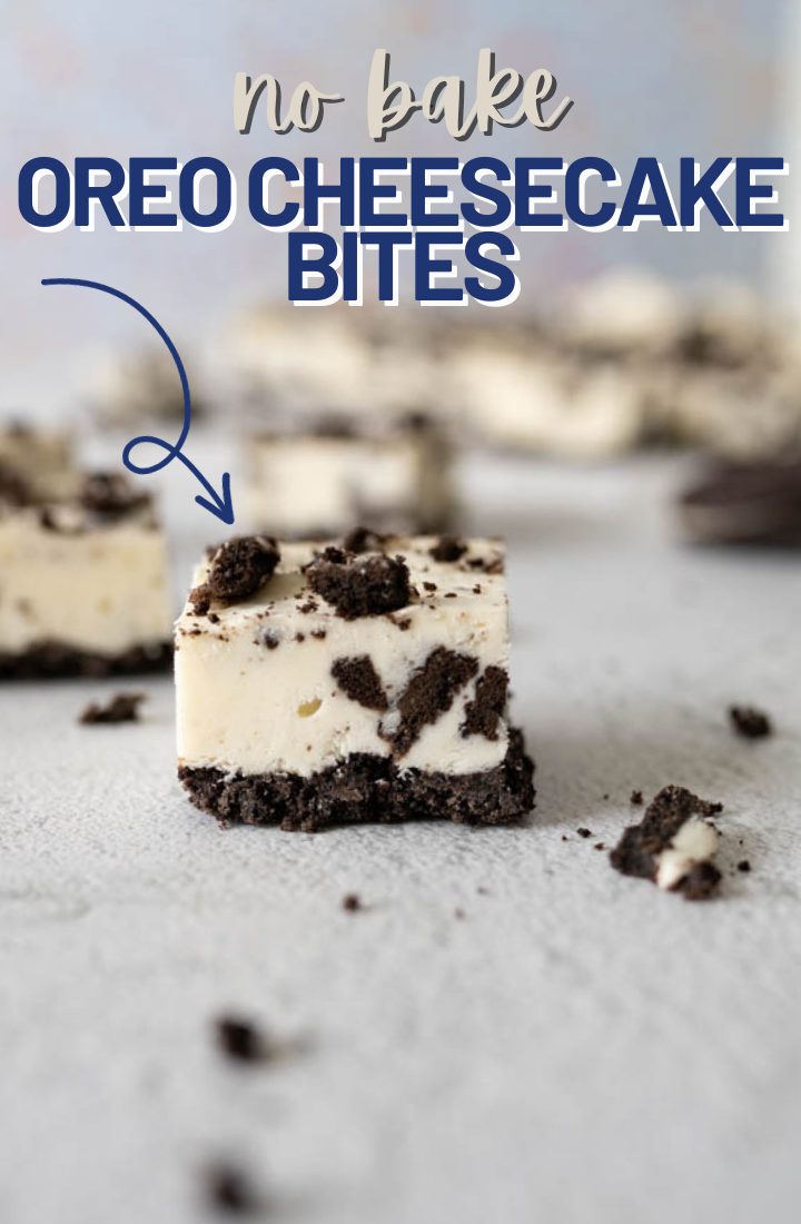 One oreo cheesecake bite in focus on the counter. Across the top it says "no bake oreo cheesecake bites" 