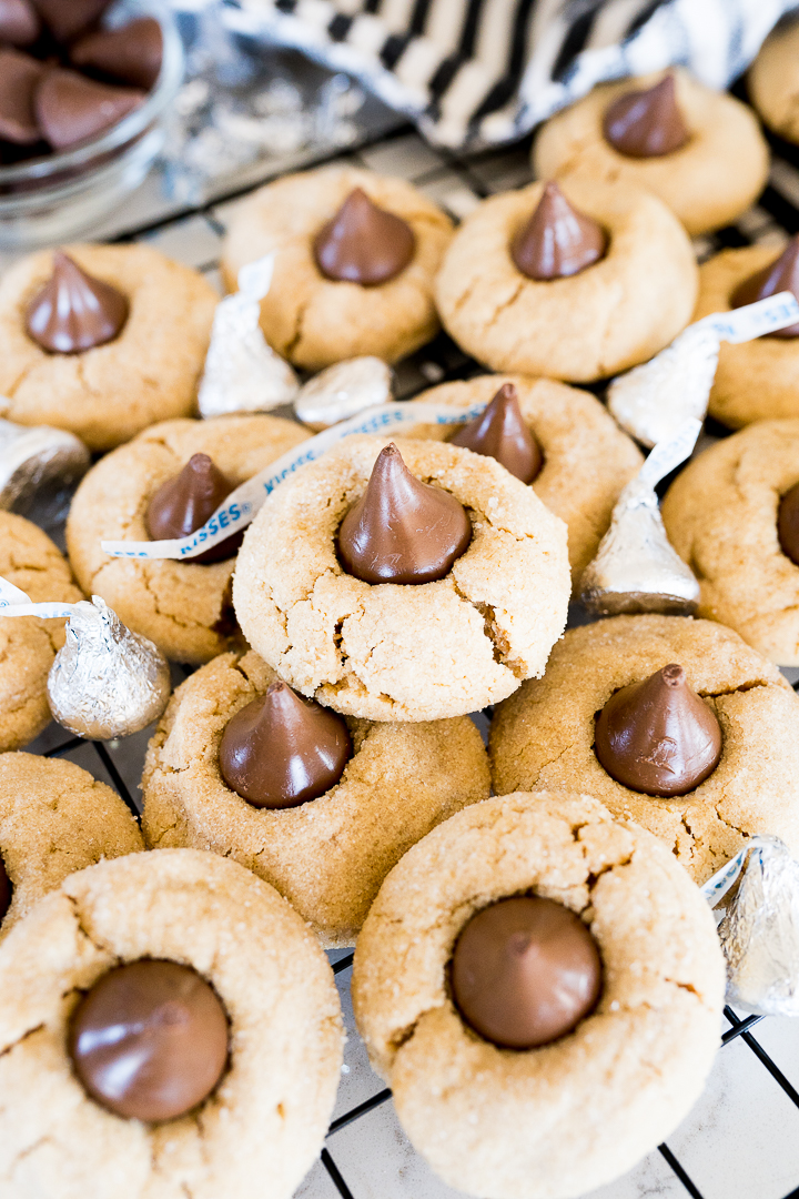 A pile of classic peanut butter hershey kiss cookies.