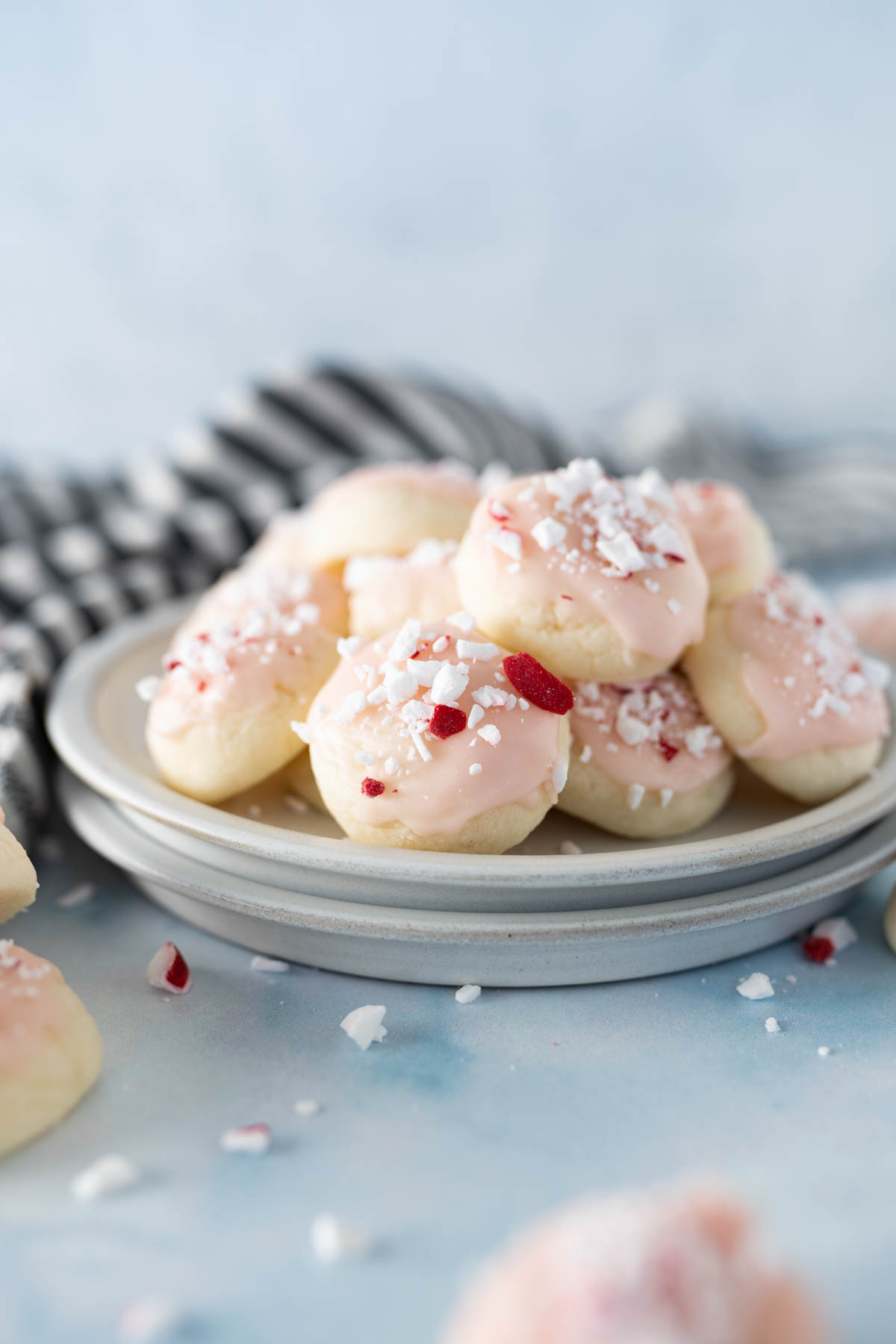 A plate of peppermint meltaway cookies sitting on a counter. 