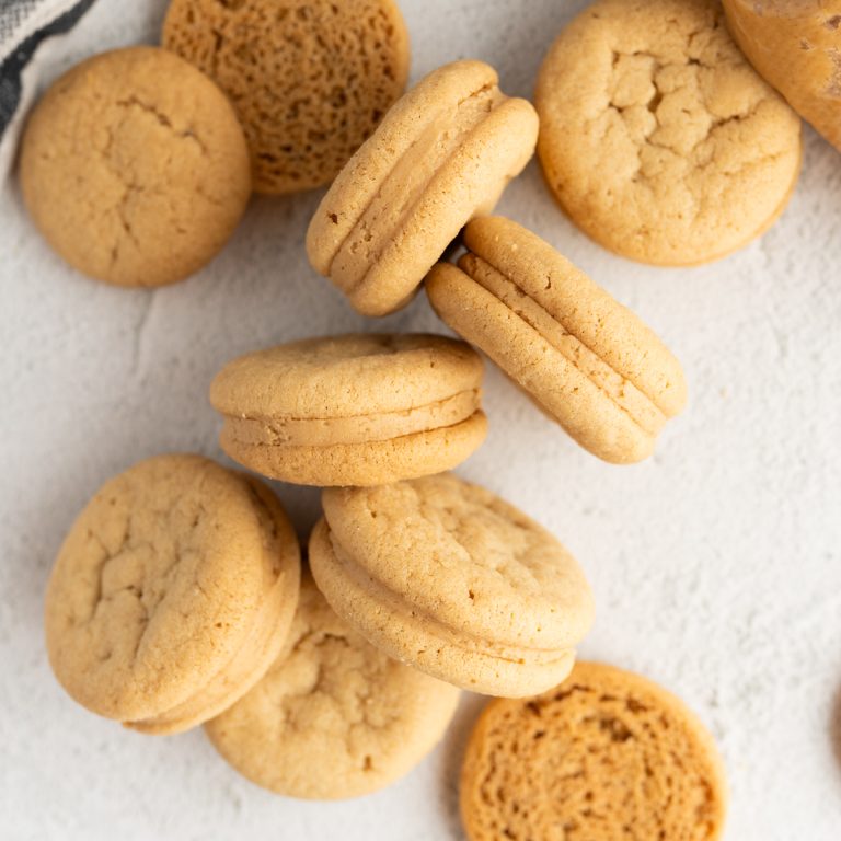 Aerial image of nutter butter sandwich cookies arranged on the counter.