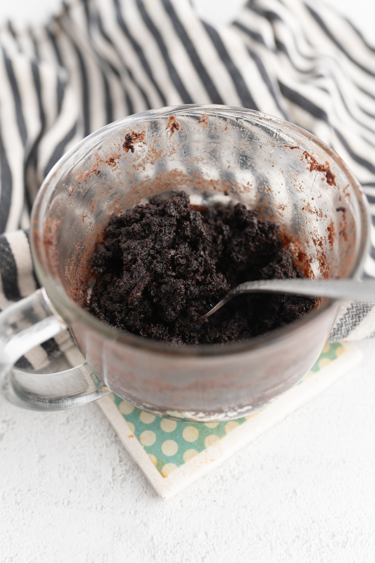 A fork diving into a chocolate mug cake