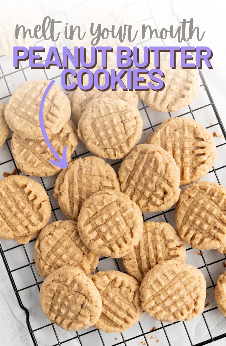 A pile of peanut butter cookies spread out on a wire cooling rack. Across the top it says "melt in your mouth peanut butter cookies" in text.