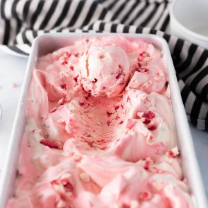 peppermint chip ice cream with a scoop taken out of it.