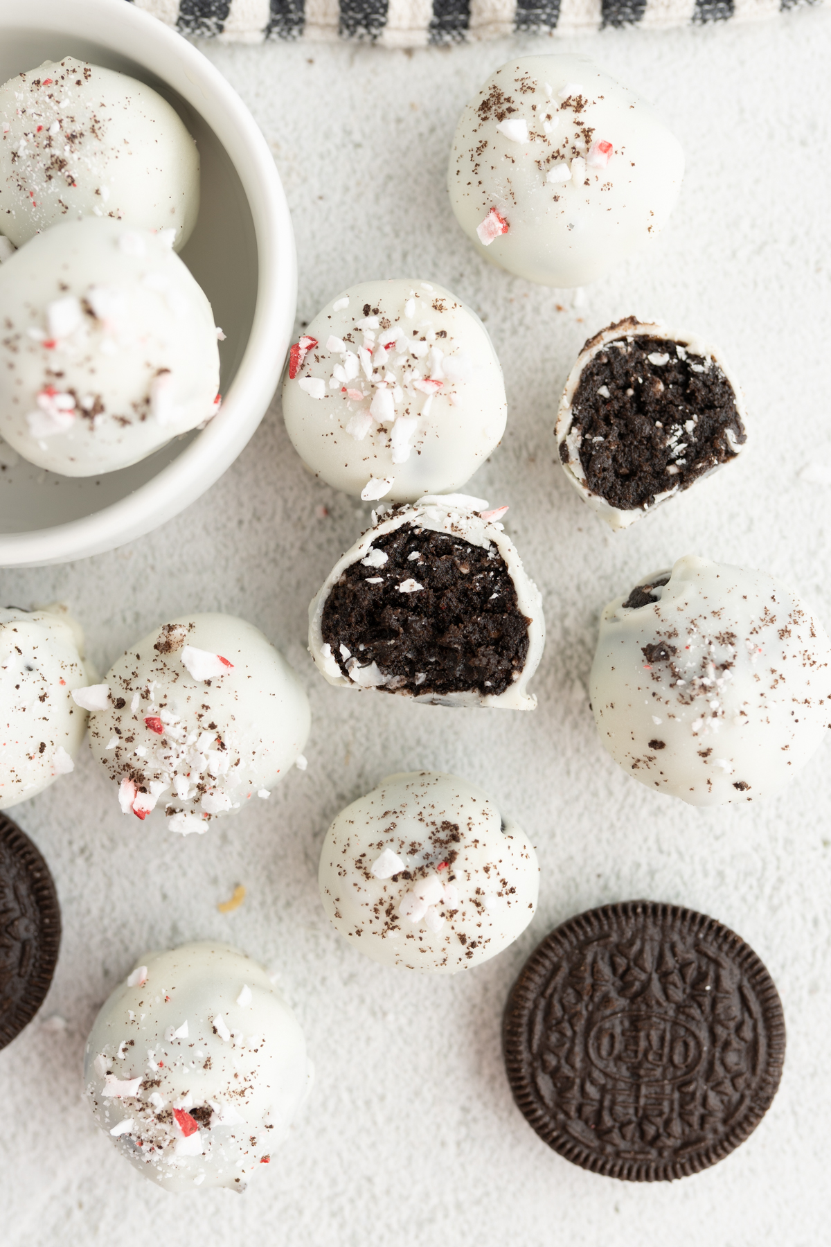 Aerial view of peppermint oreo truffles spread out on the counter.