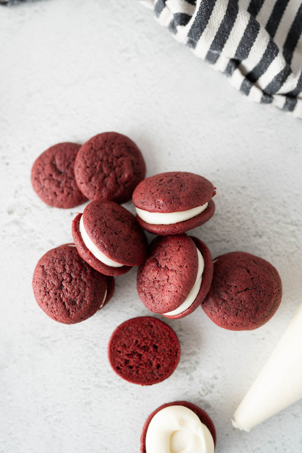 Aerial view of red velvet whoopie pies scattered on the counter. 
