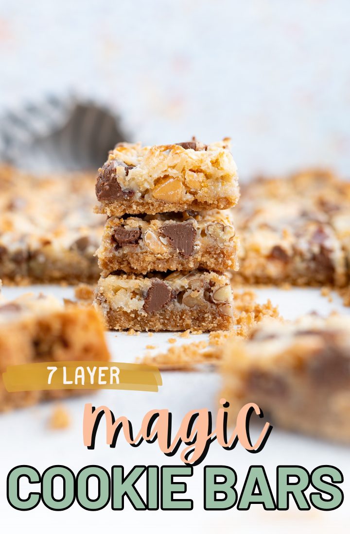 A stack of 7 layer magic cookie bars on the counter surrounded by additional bars. Across the bottom it says "7 layer magic cookie bars" in text.