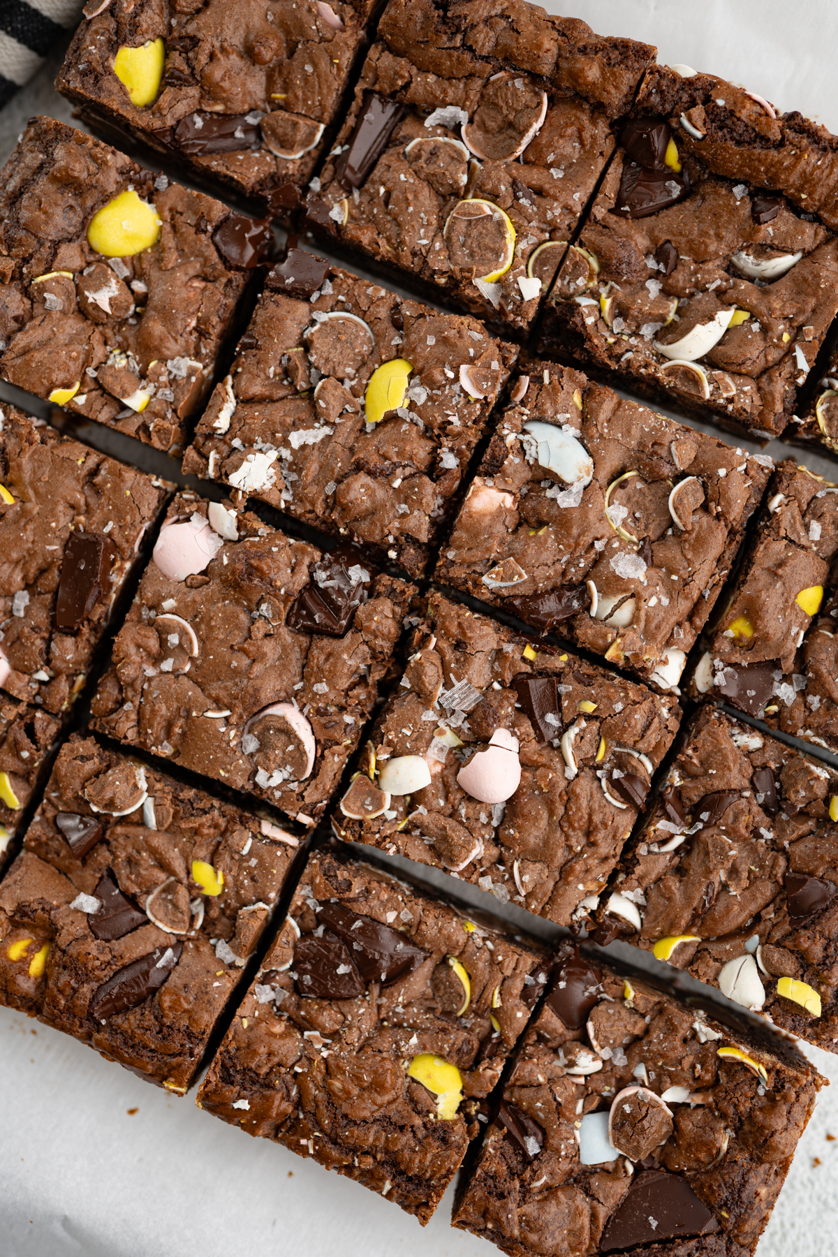 Aerial view of a pan of cadbury egg brownies cut into squares. 
