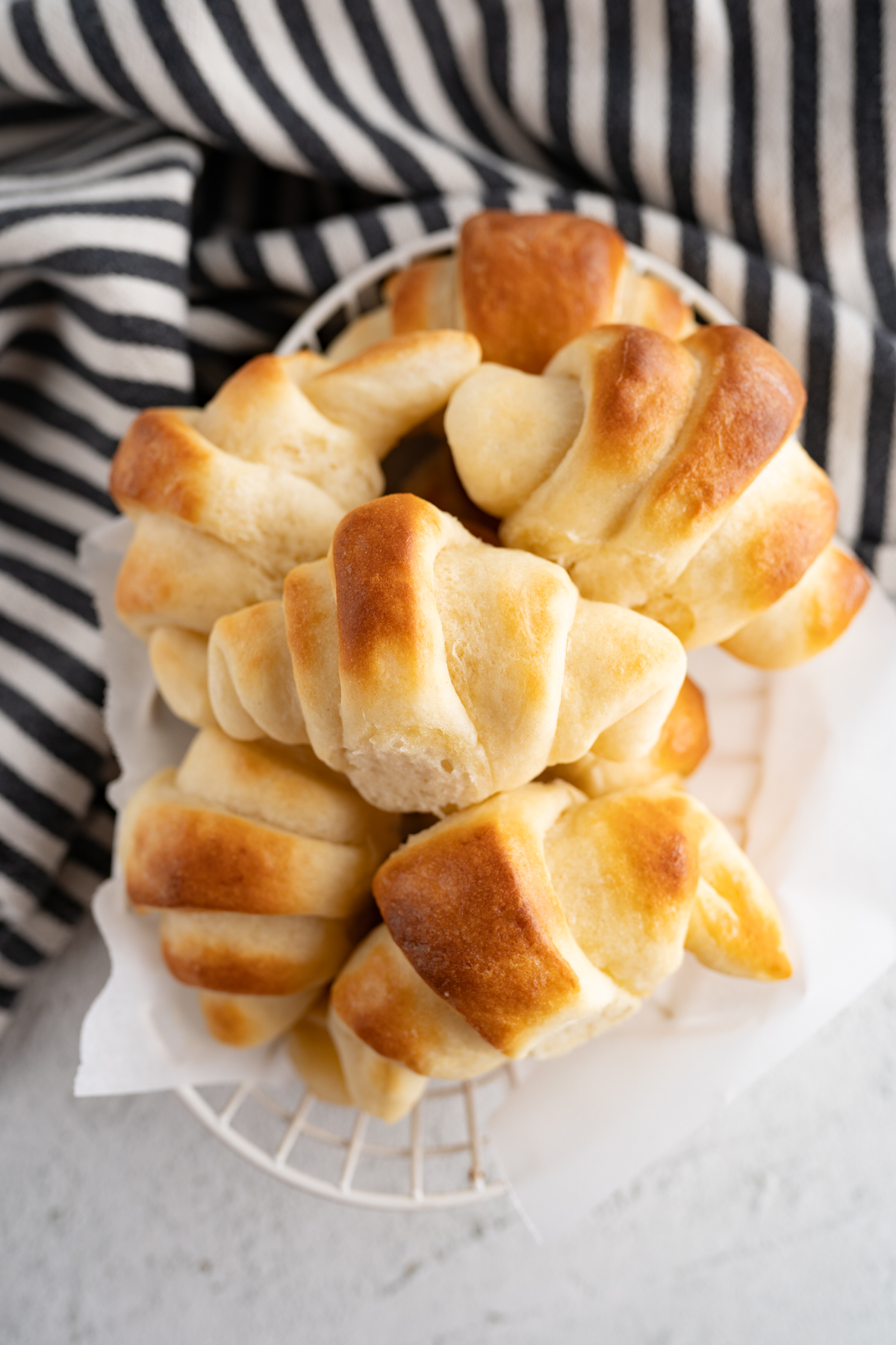 Aerial view of a bowl of homemade crescent rolls. 