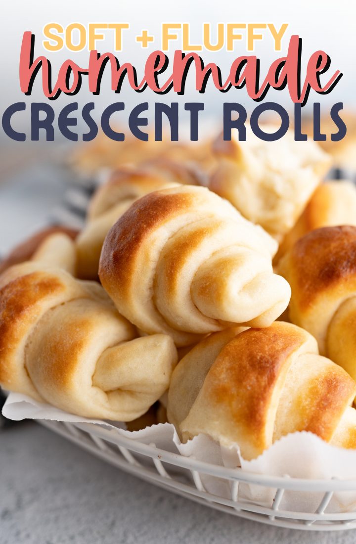 Close up of homemade crescent rolls in a bowl. Across the top it says "soft + fluffy homemade crescent rolls" 