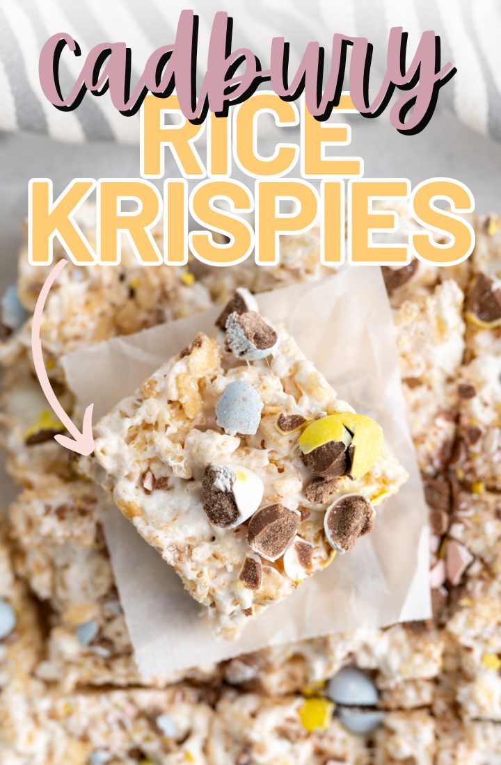 A cadbury egg rice krispy treat on a piece of parchment paper on top of additional krispies. Across the top it says "cadbury rice krispies" 