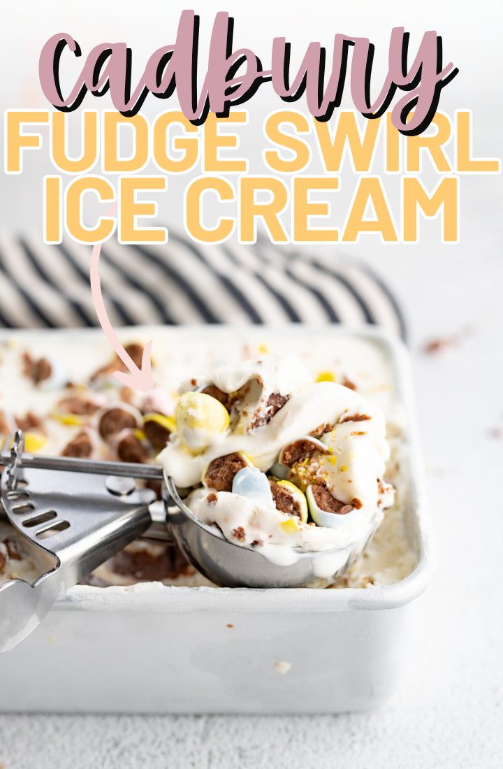 A serving dish of cadbury egg ice cream witha scoop taken out of it. Across the top it says "cadbury fudge swirl ice cream" in text.