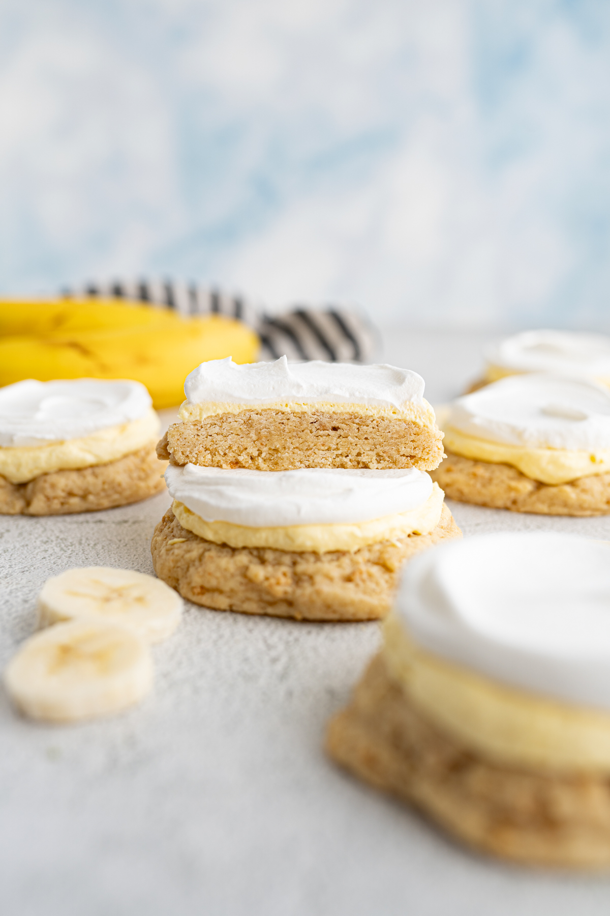 A twisted sugar copycat banana cookie cut in half with the interior slice showing. 