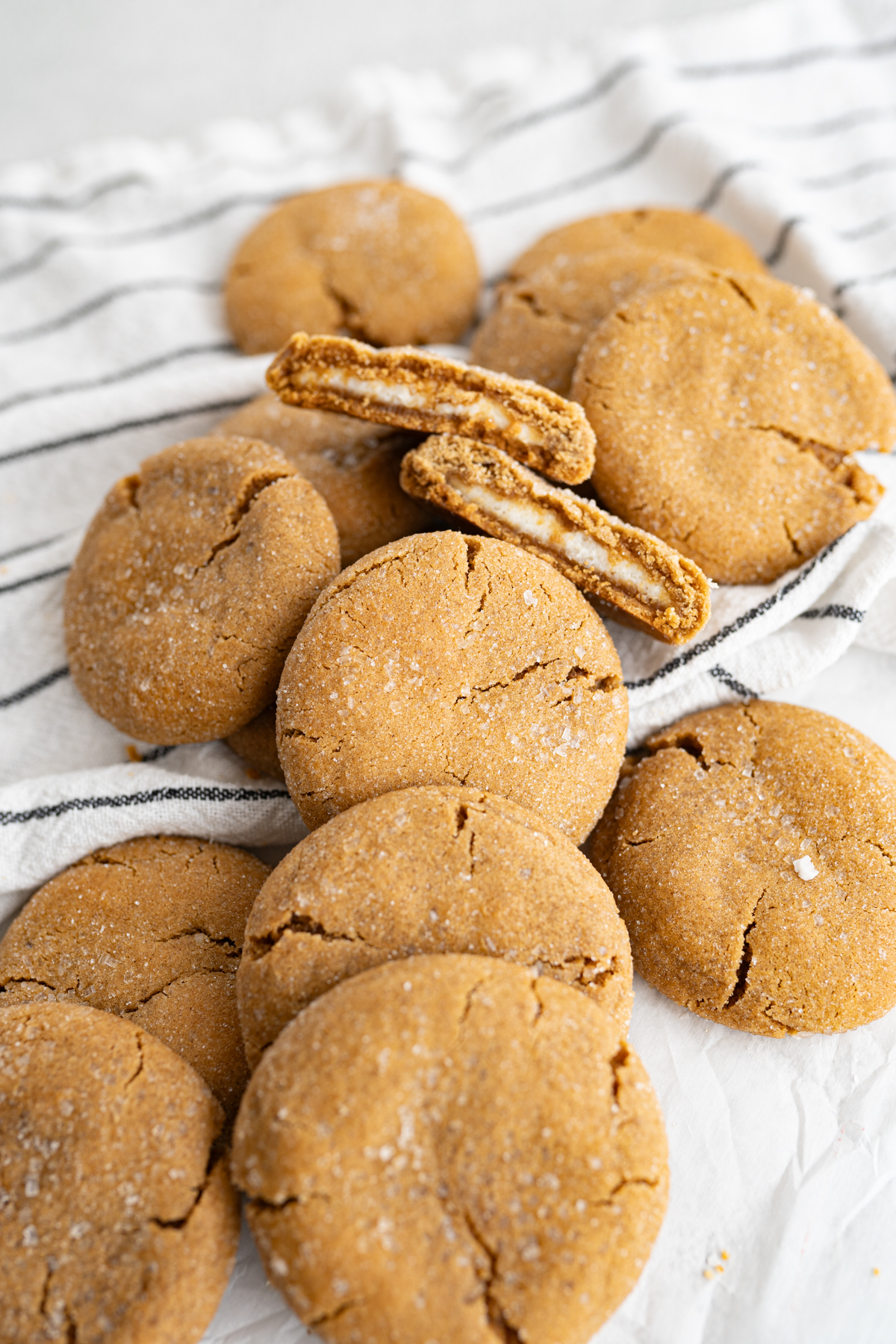 gingerbread cookies rolled in sugar and filled with cheesecake filling. 