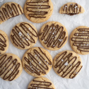 Mini crumbl hazelnut sea salt cookies on the counter.