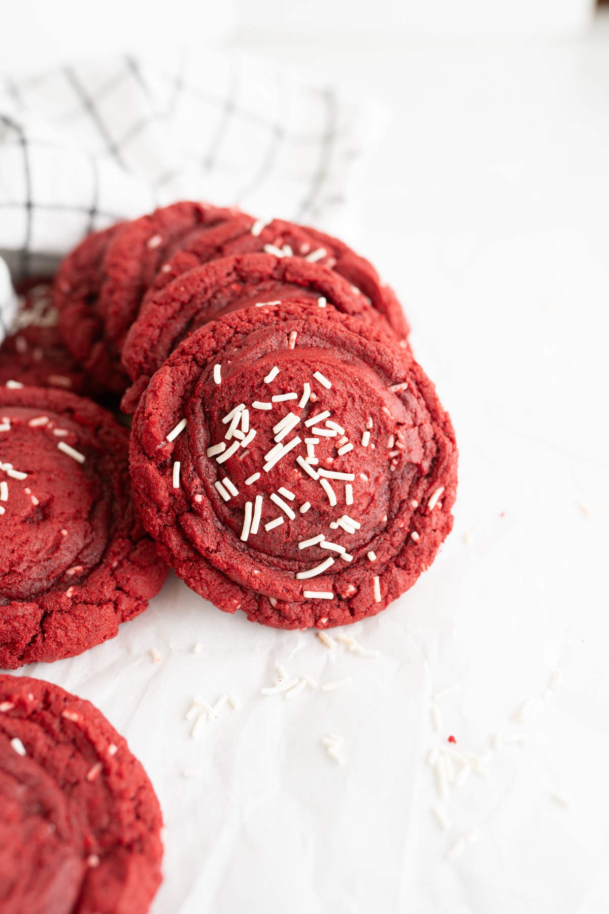 Cake mix cookies, red velvet flavored, scattered on the counter. 