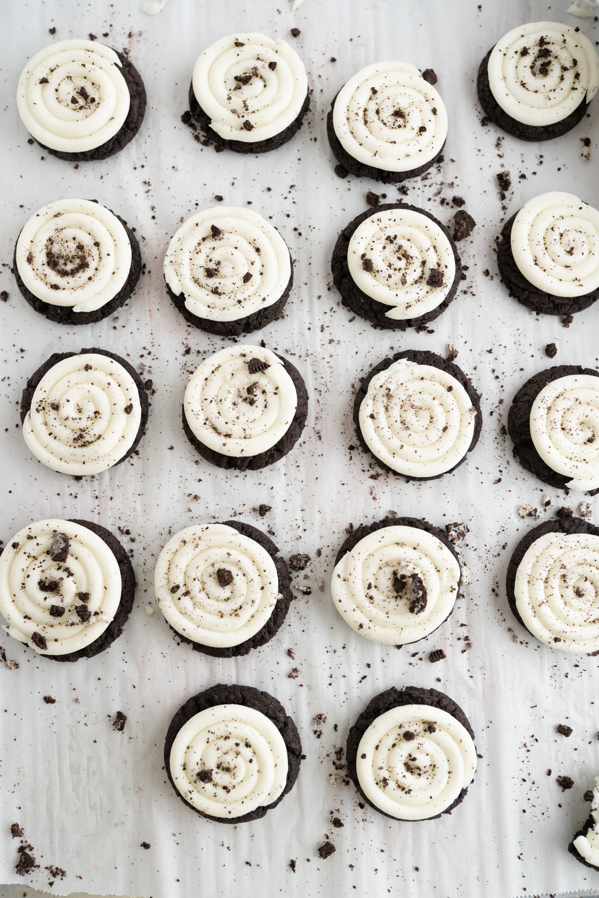 A counter filled with oreo crumbl cookies (catering size!). 