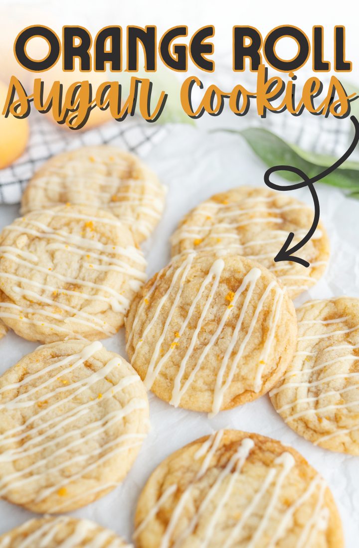 A soft orange roll sugar cookie lined up on the counter.