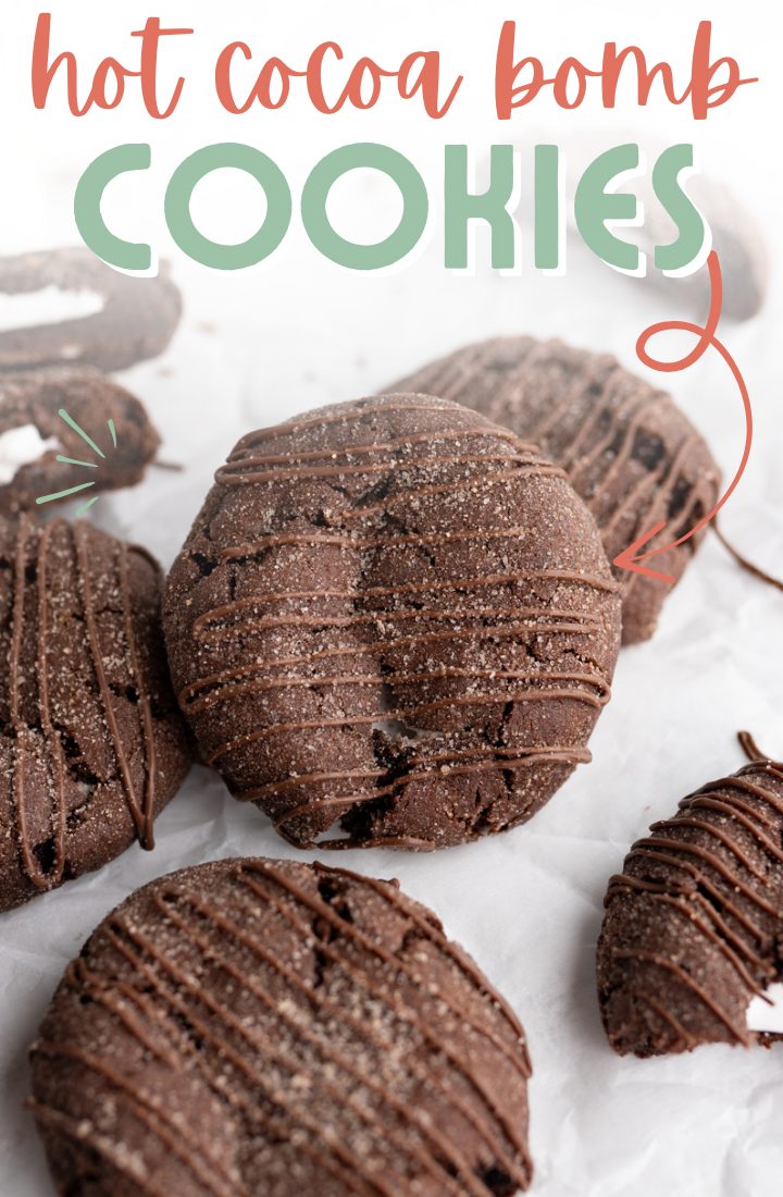 A chocolate cookie rolled in hot cocoa powder, stuffed with a marshmallow and drizzled with chocolate. Across the top it says "mini hot cocoa bomb cookies" 
