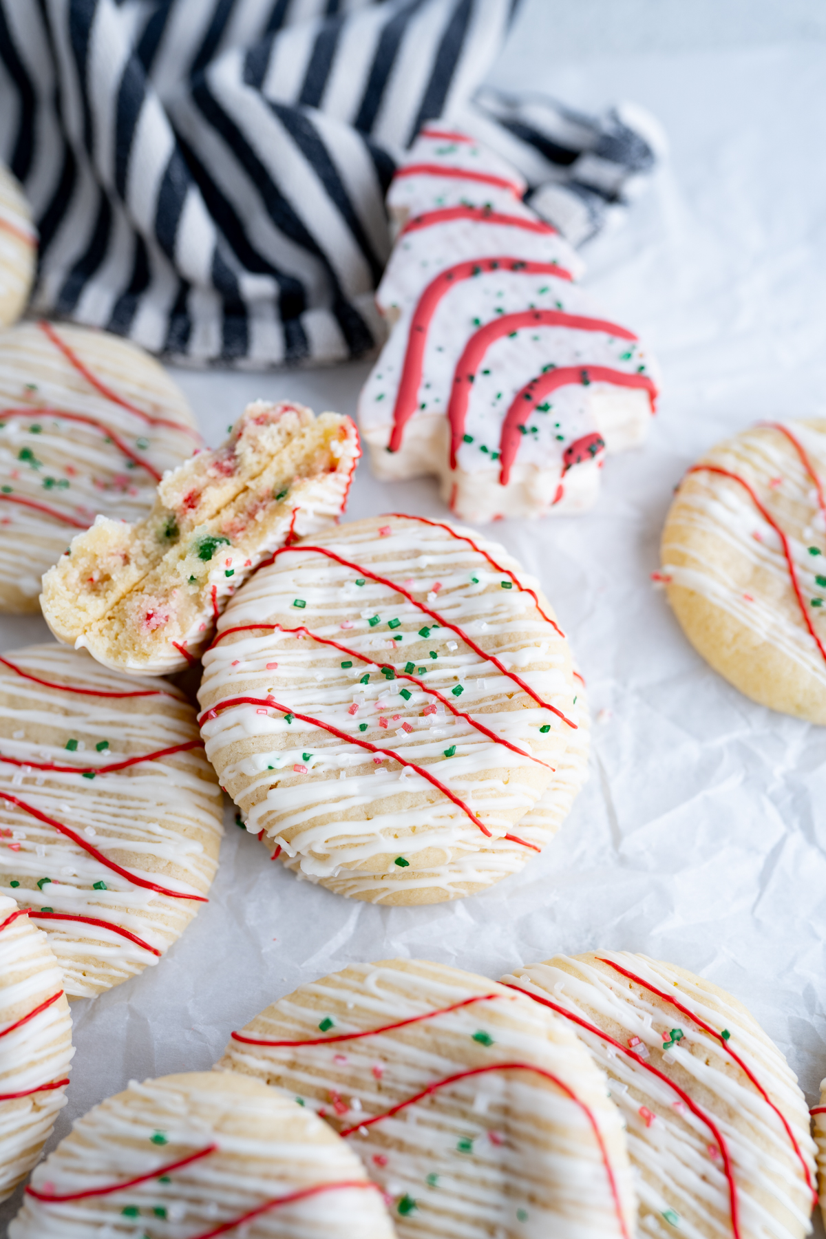 A filled sugar cookie decorated like a christmas tree cake. 