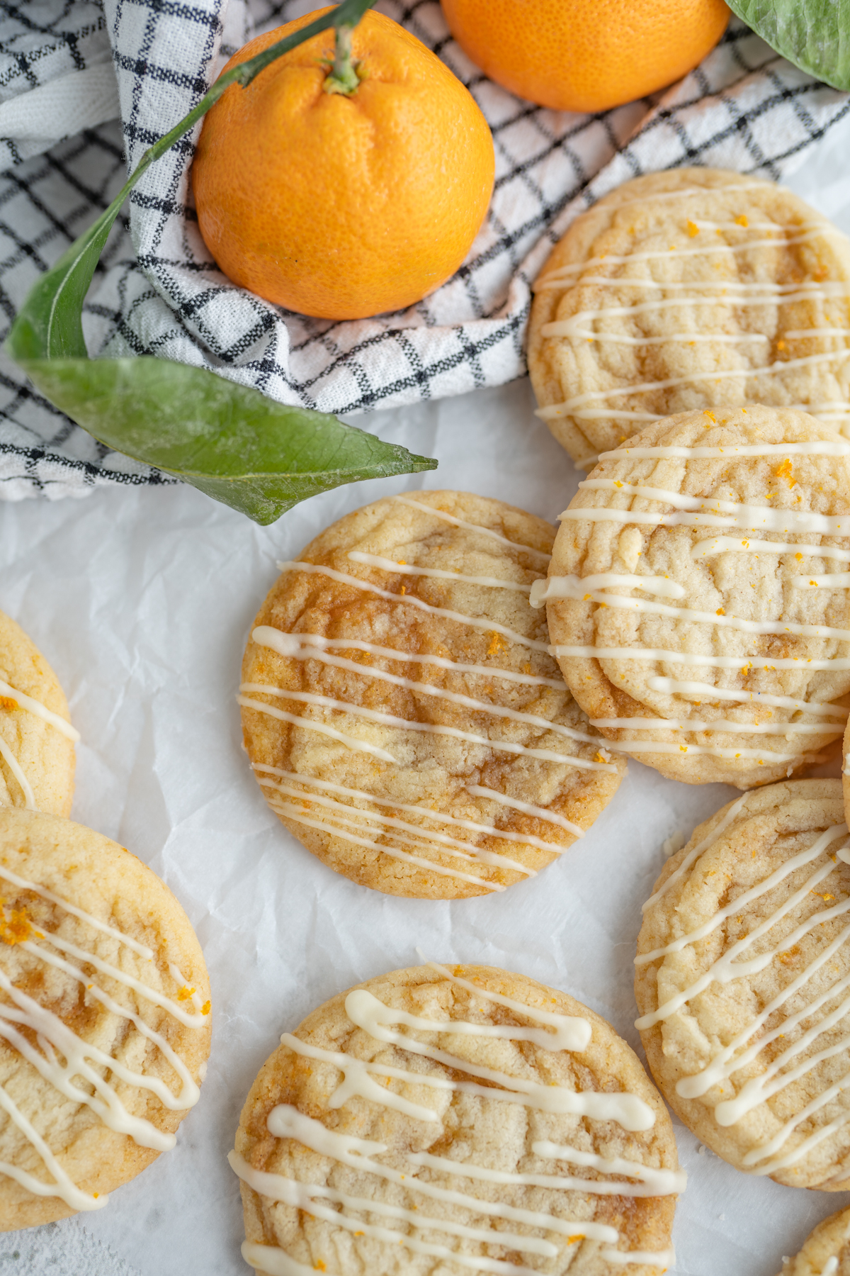 A cookie swirled with orange roll filling on the counter. 