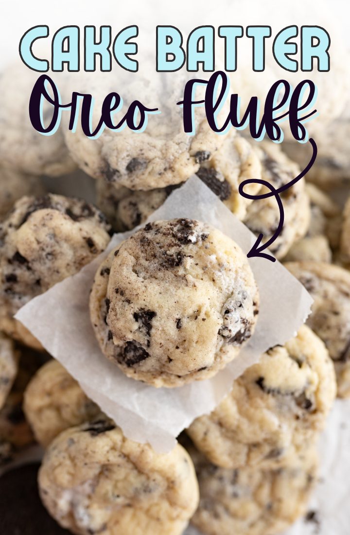 Close up of a cookie sitting on top of a pile of other cookies. Across the top it says "cake batter Oreo fluff" in text.
