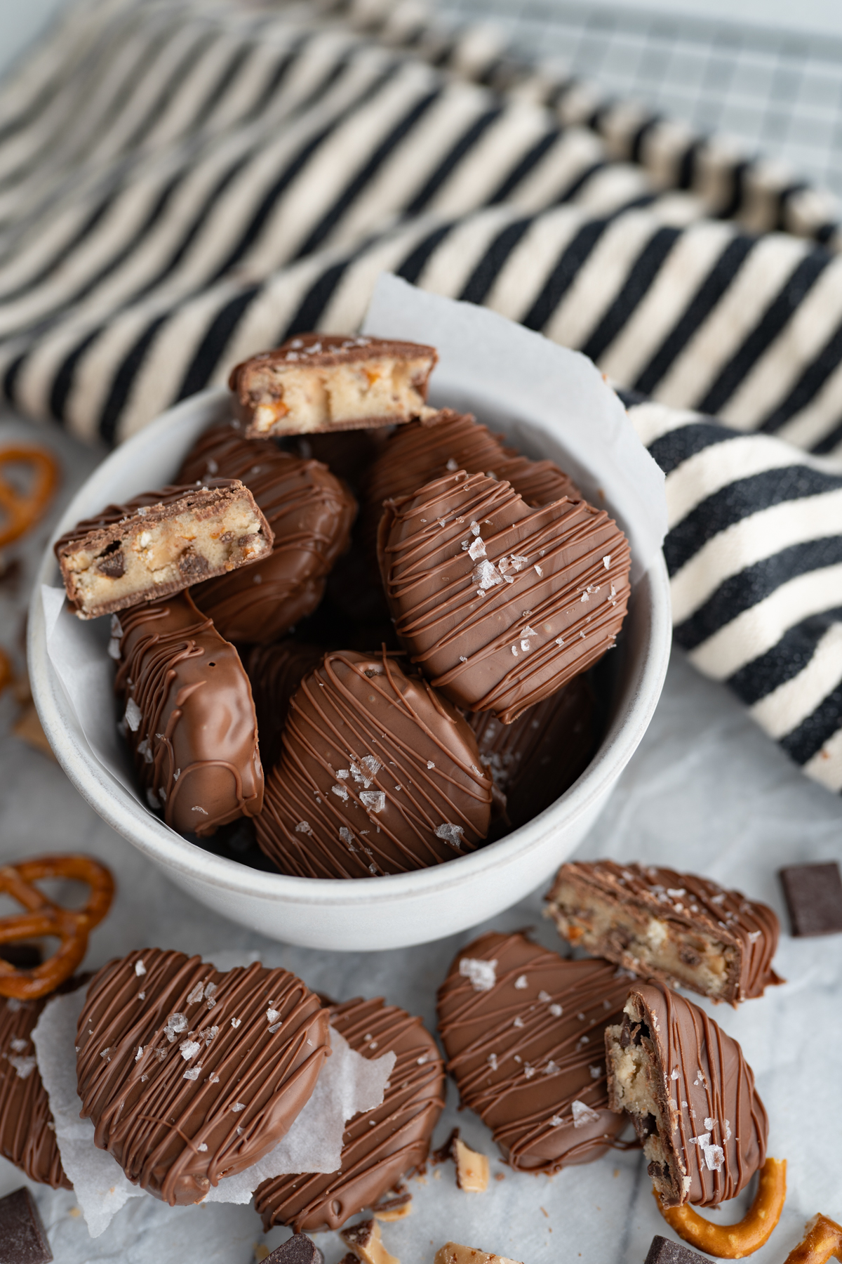 Chocolate chip, pretzel, and toffee cookie dough shaped into hearts. 